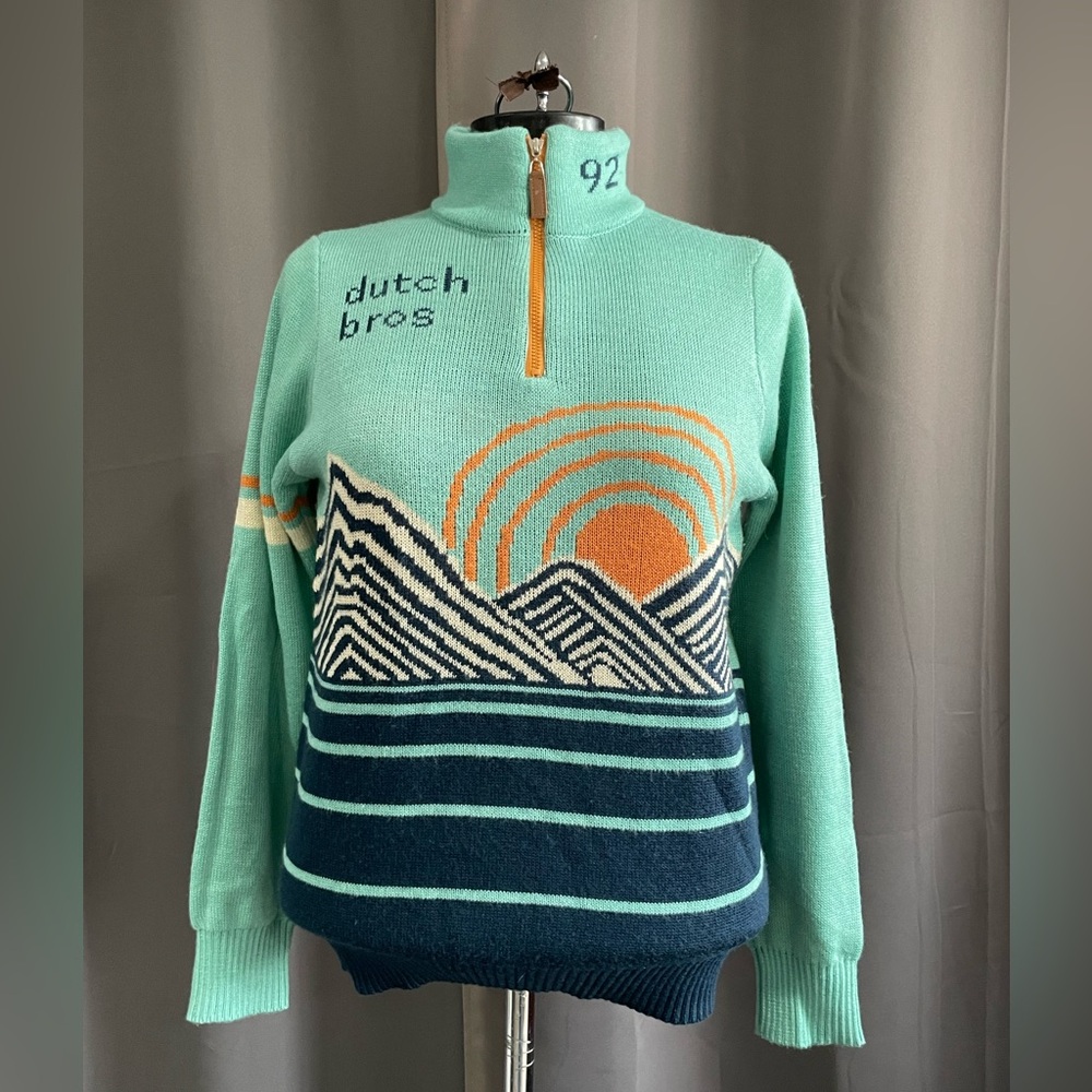 Teal Dutch Bros turtleneck sweater.